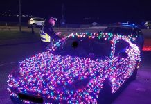 Motorist who covered his car with Christmas lights is pulled over by police – as officers warn they could ‘end up on Santa’s naughty list’